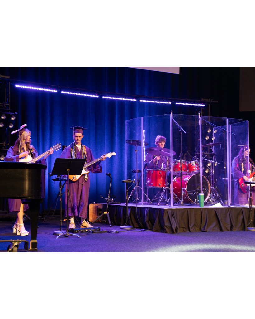 students playing in a band on stage at graduation