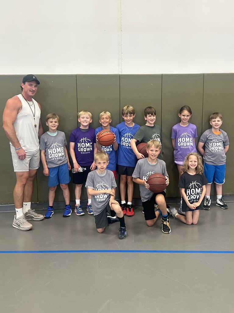 group picture of coach and basketball players
