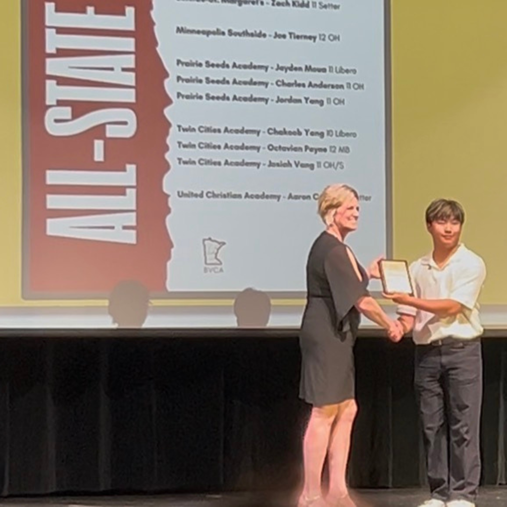 volleyball player accepting an award