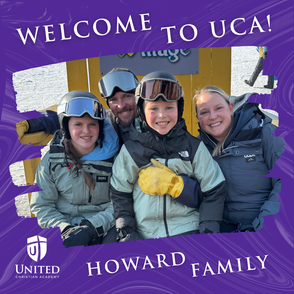 family picture of parents and two kids on a ski hill