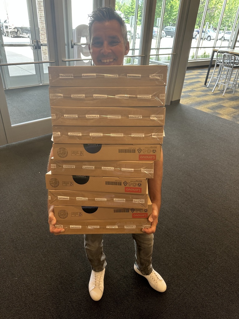 man holding a stack of boxes