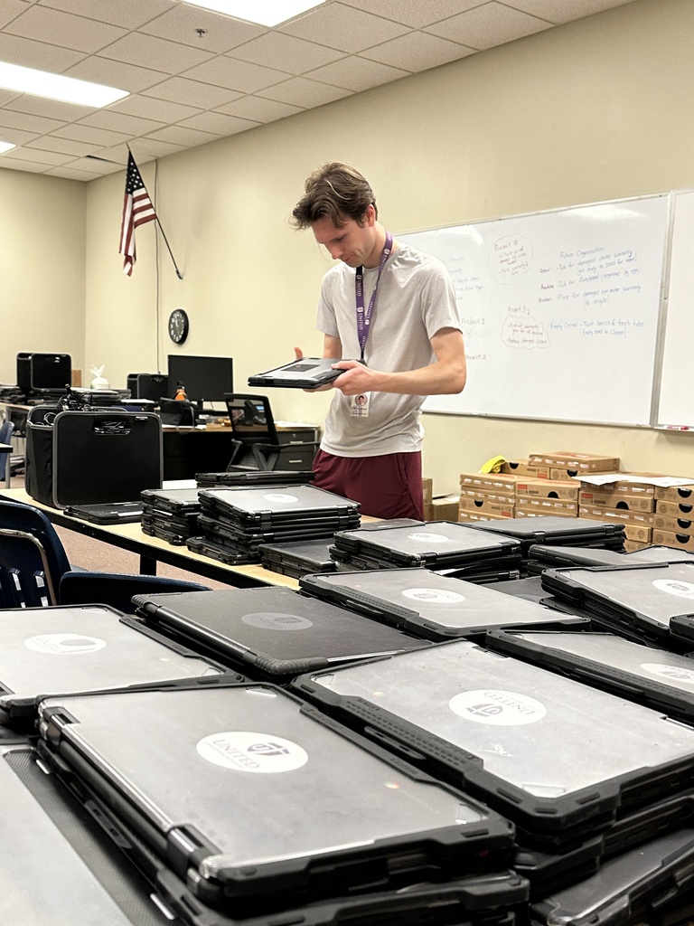 man looking at a chromebook