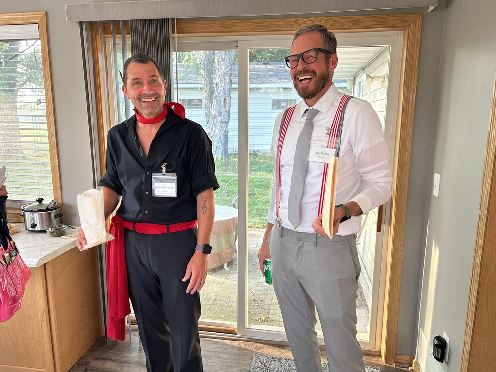 two men standing in a kitchen