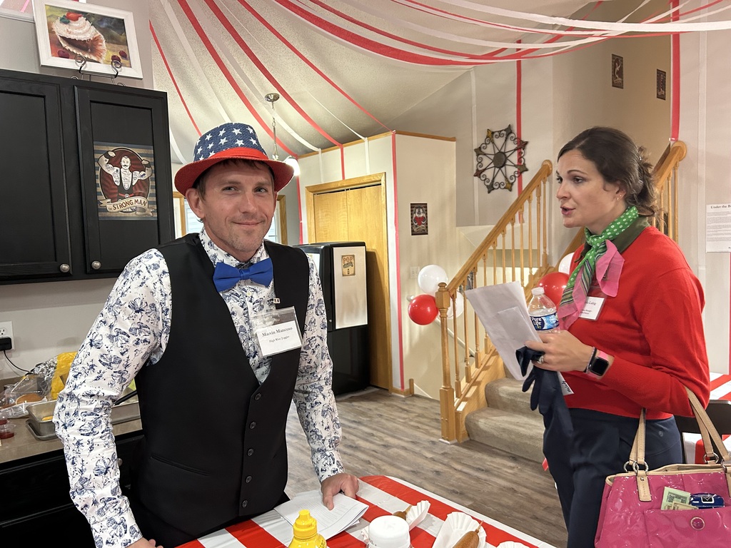 two people dressed up for a murder mystery dinner