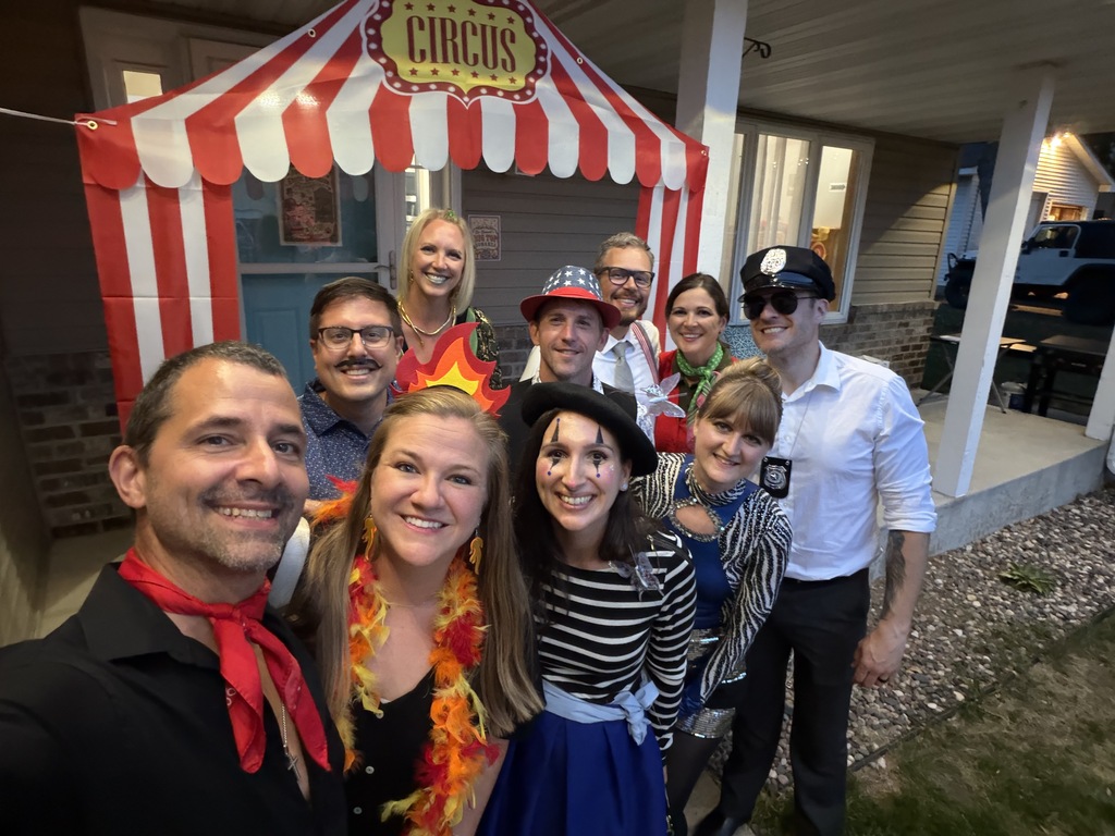 group photo of people dressed up for a murder mystery dinner