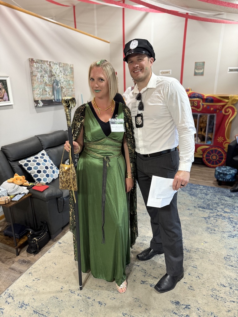 husband and wife dressed up for a murder mystery dinner