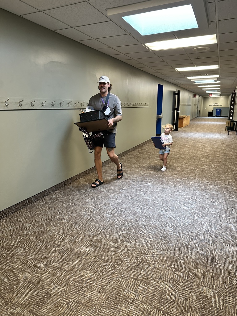 man and his daughter moving furniture