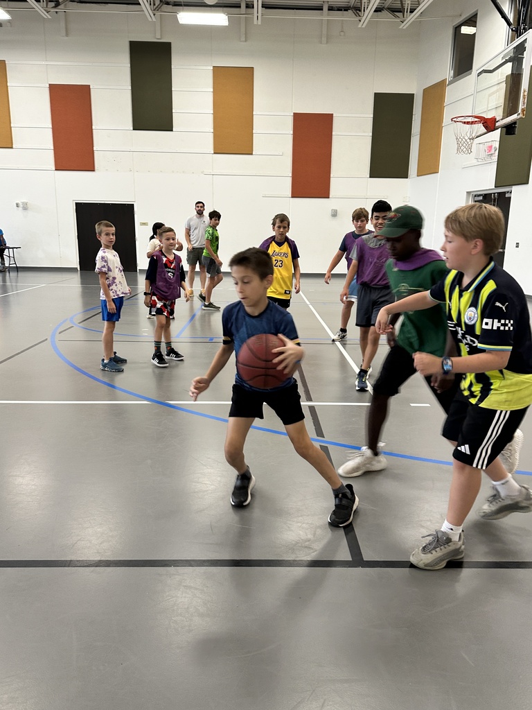 kids playing basketball in a gym