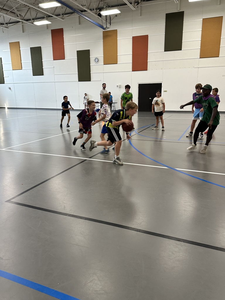 kids playing basketball in a gym