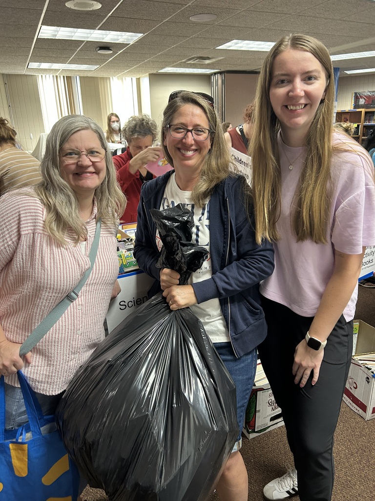 three teachers at a book sale