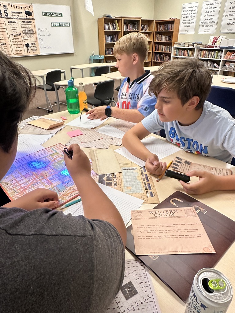 students using black lights to solve puzzles