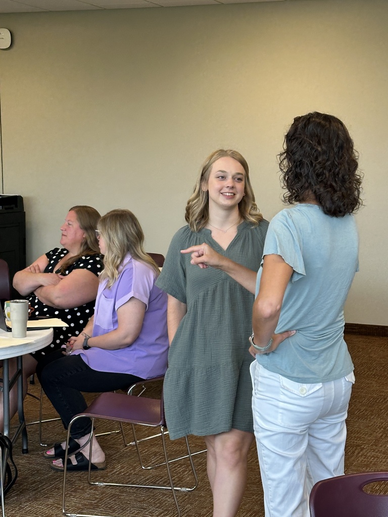 group of teachers talking to each other