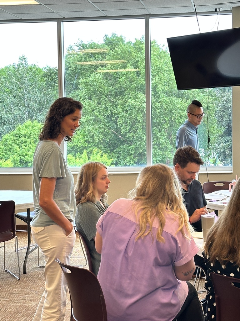 group of teachers talking to each other