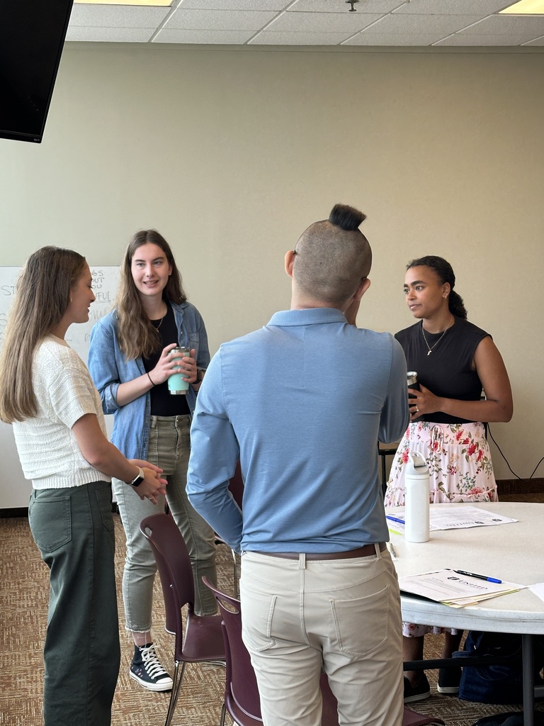 group of teachers talking to each other