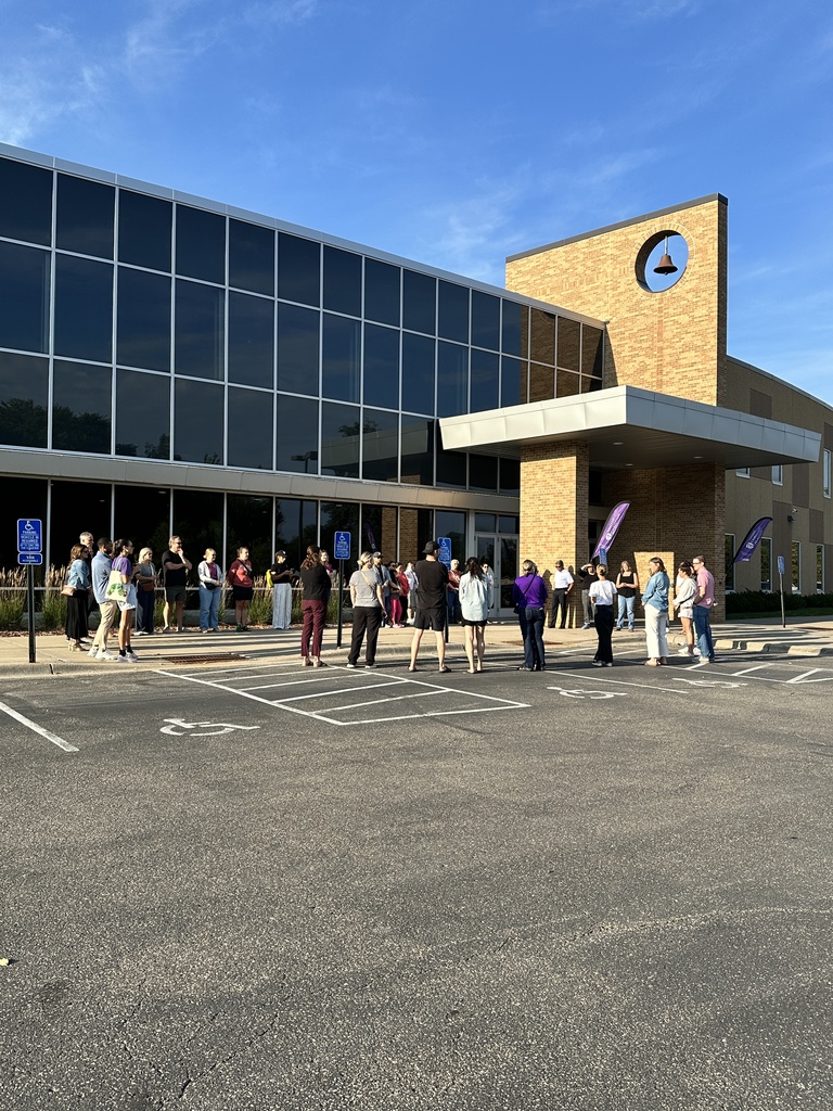 a group of parents gathered outside to pray for our school