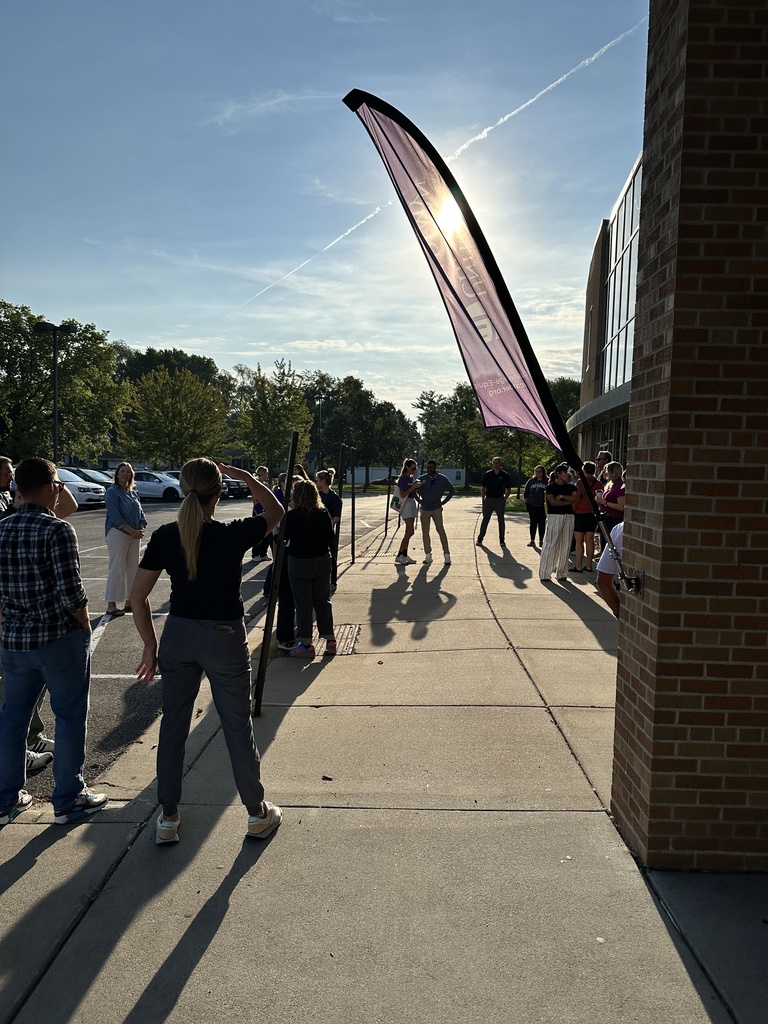 a group of parents gathered outside to pray for our school