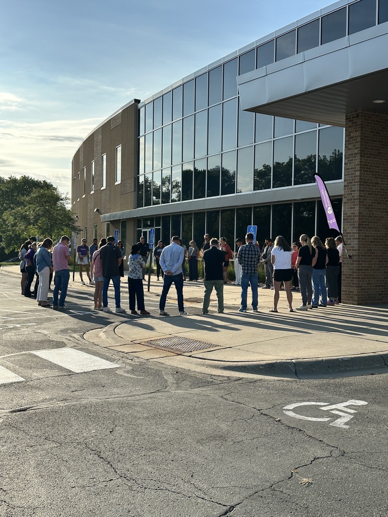 a group of parents gathered outside to pray for our school