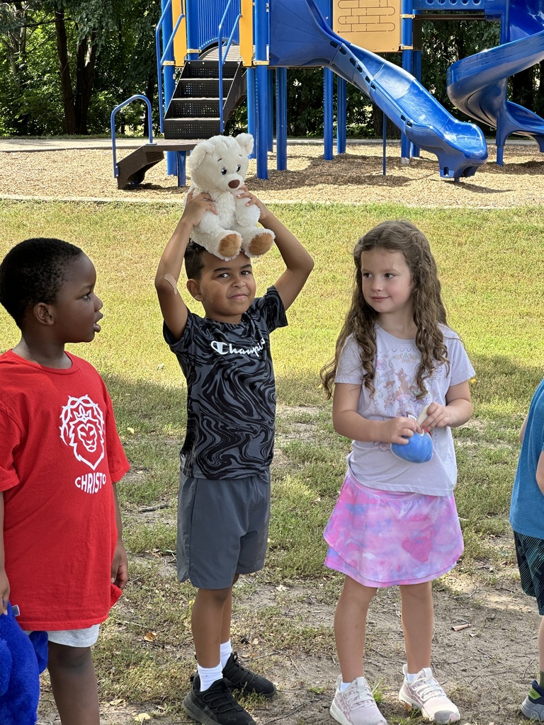 students holding stuffed animals