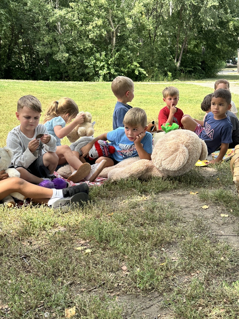 students sitting outside having a picnic