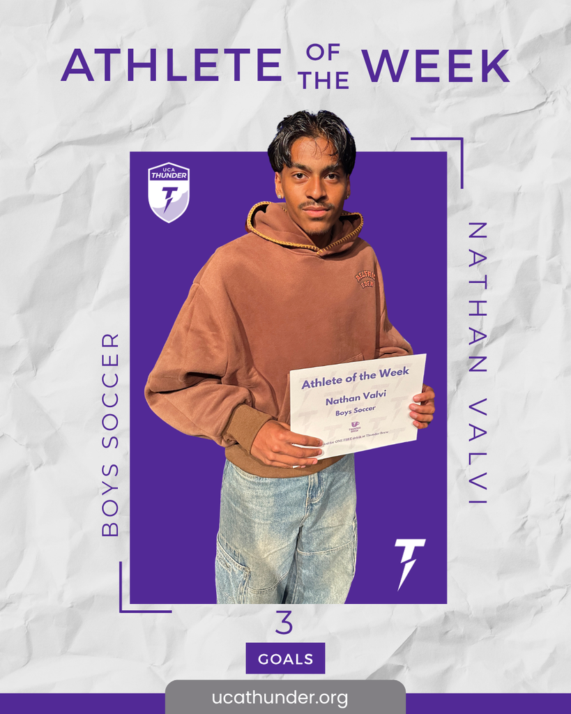 male student holding a certificate
