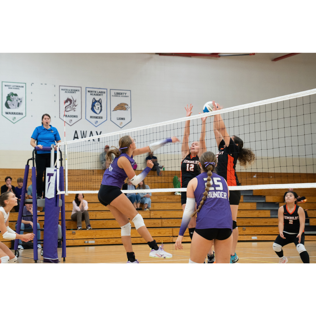 high school girls playing volleyball