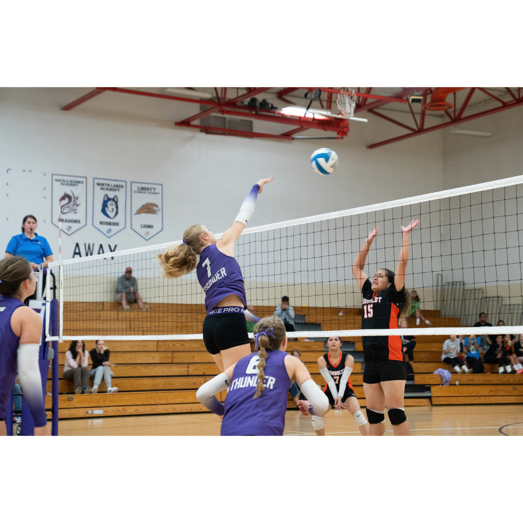 high school girls playing volleyball