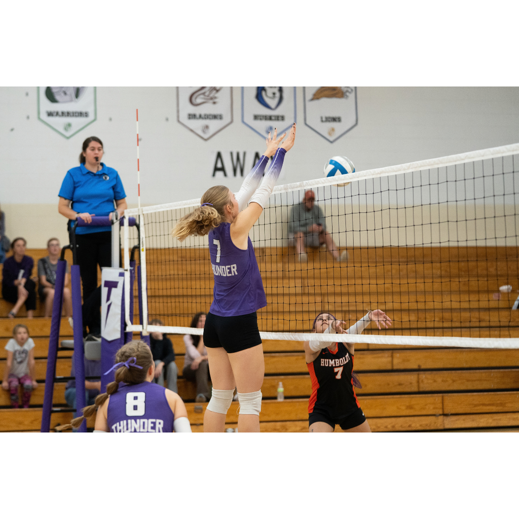 high school girls playing volleyball