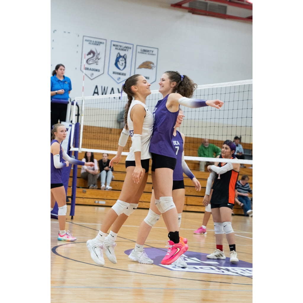 high school girls playing volleyball