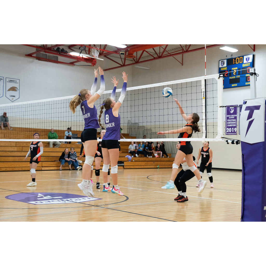 high school girls playing volleyball