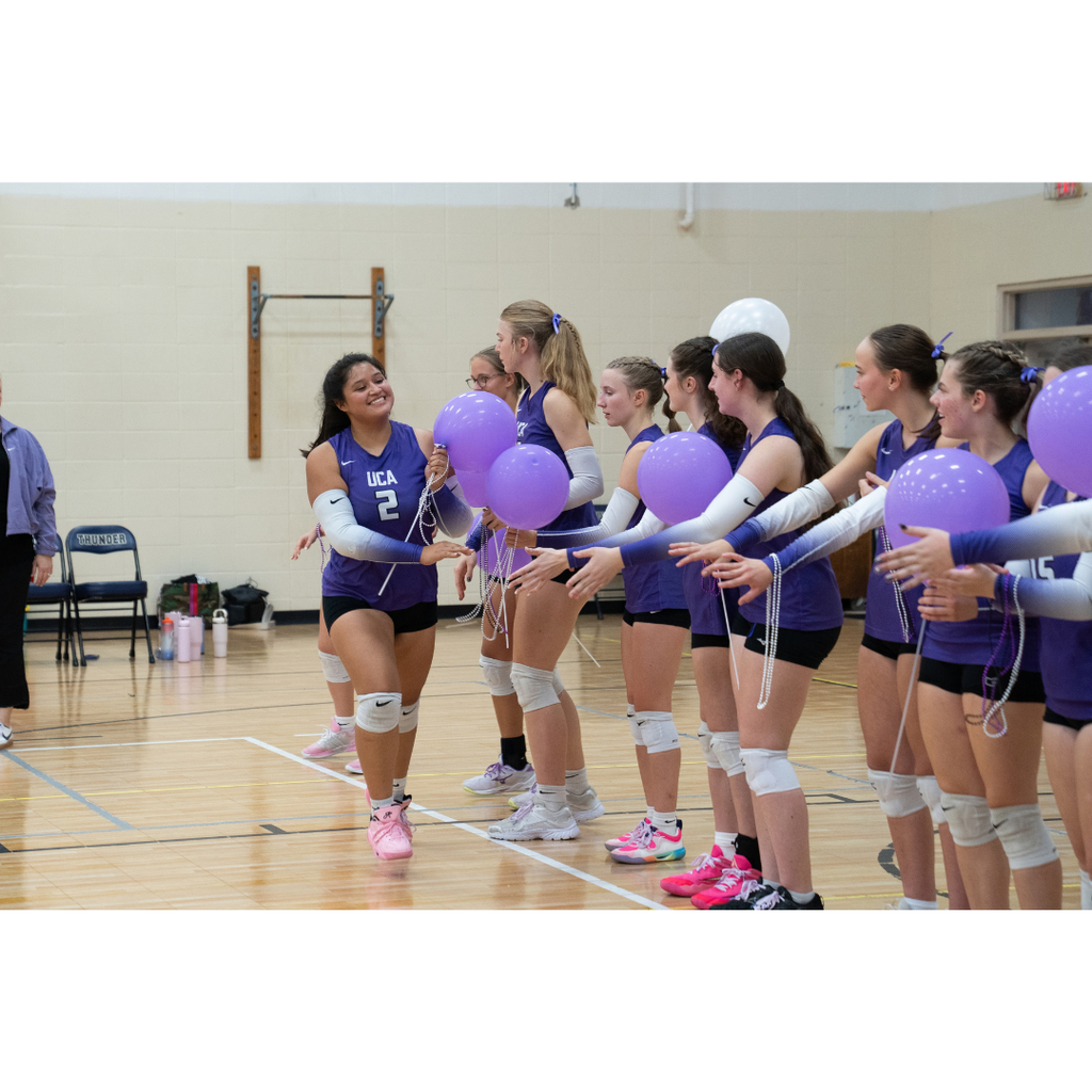high school girls playing volleyball