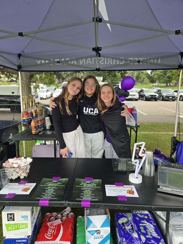 three girls working at a concession stand