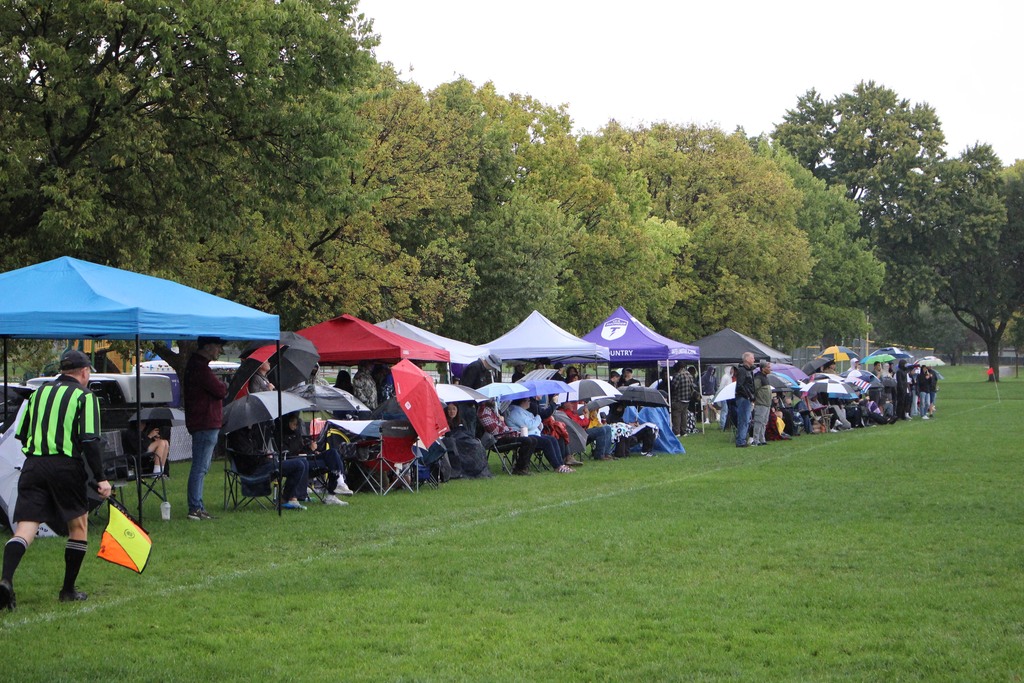 sideline of fans at a soccer game