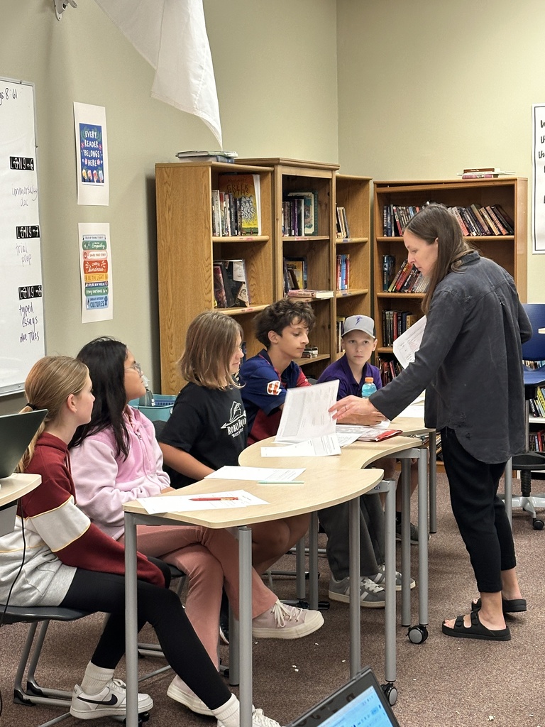 teacher talking to students acting as the jury