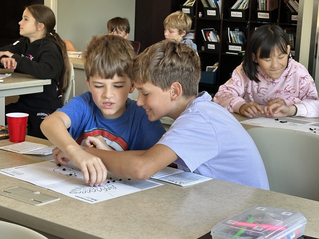 students working in pairs at their desks
