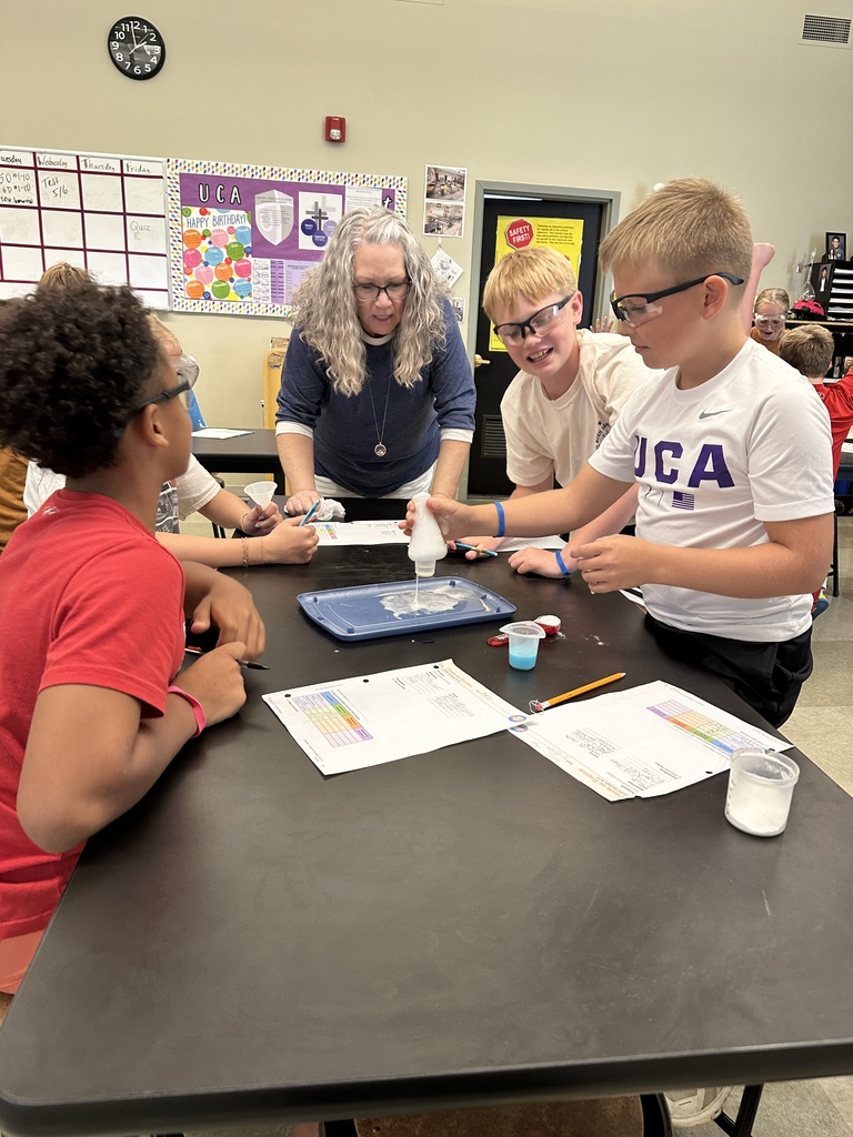 students recreating an eruption in a science experiment
