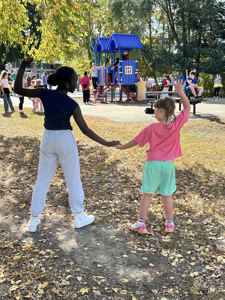 two students holding hands