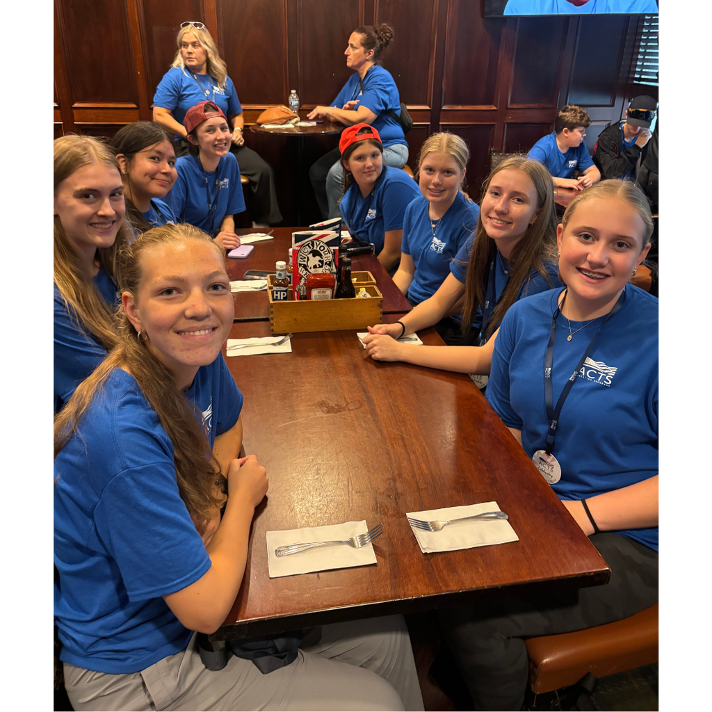 group of students at a table in a restaurant