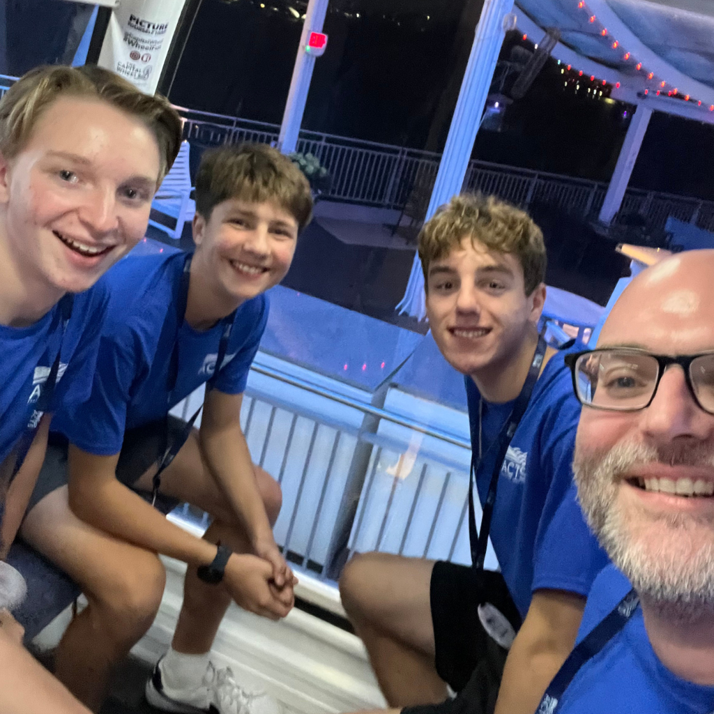 group selfie of students and a chaperone