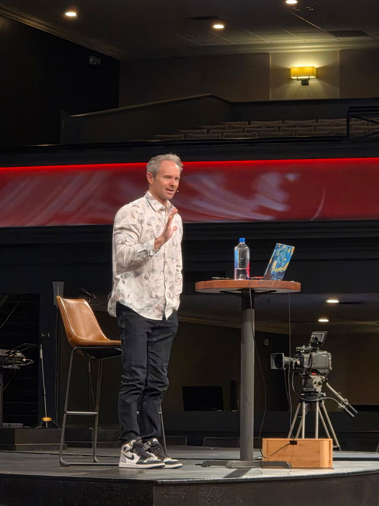 man speaking on stage