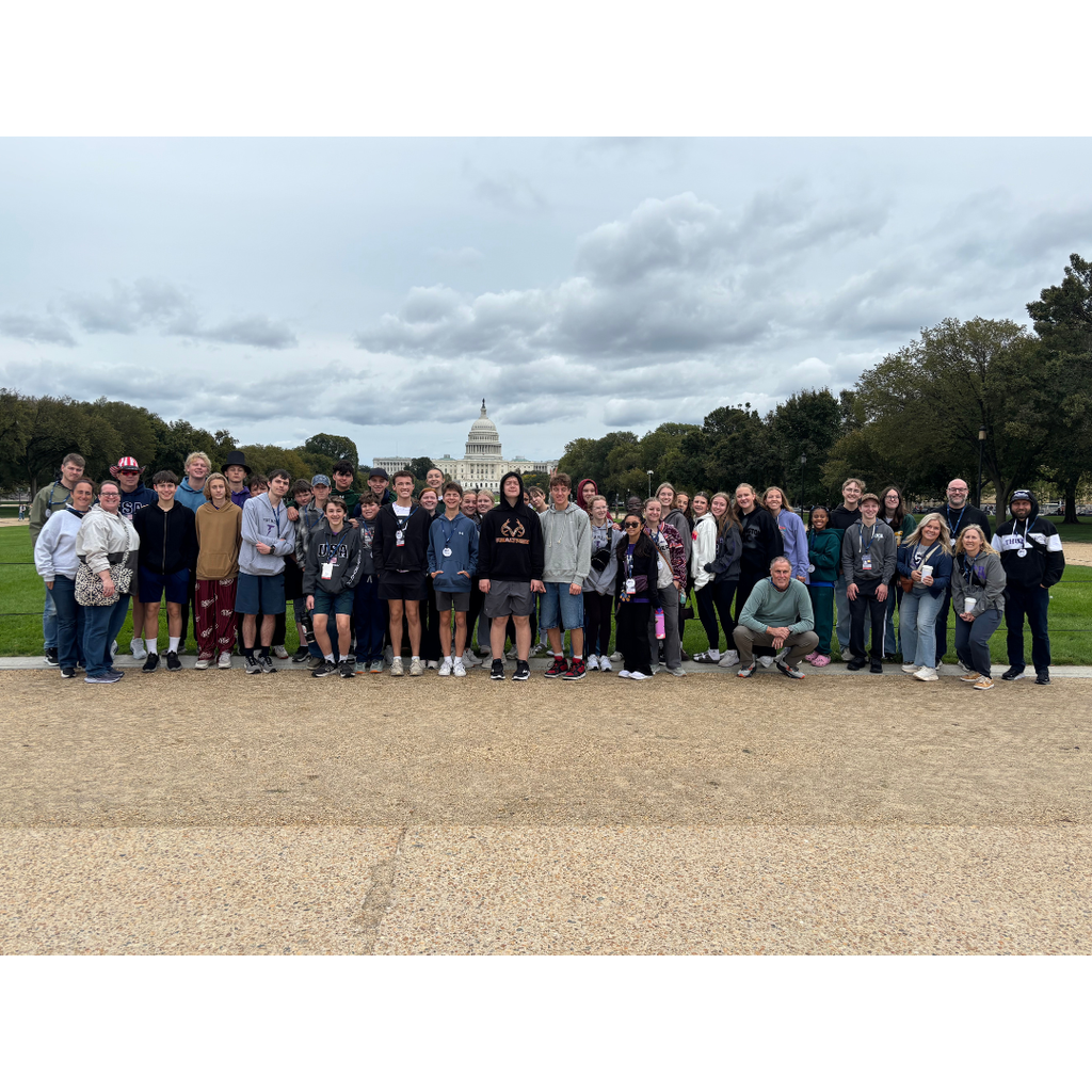 group photo with capital in the background