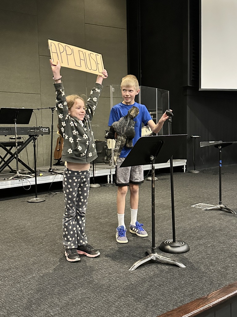 two kids acting on stage