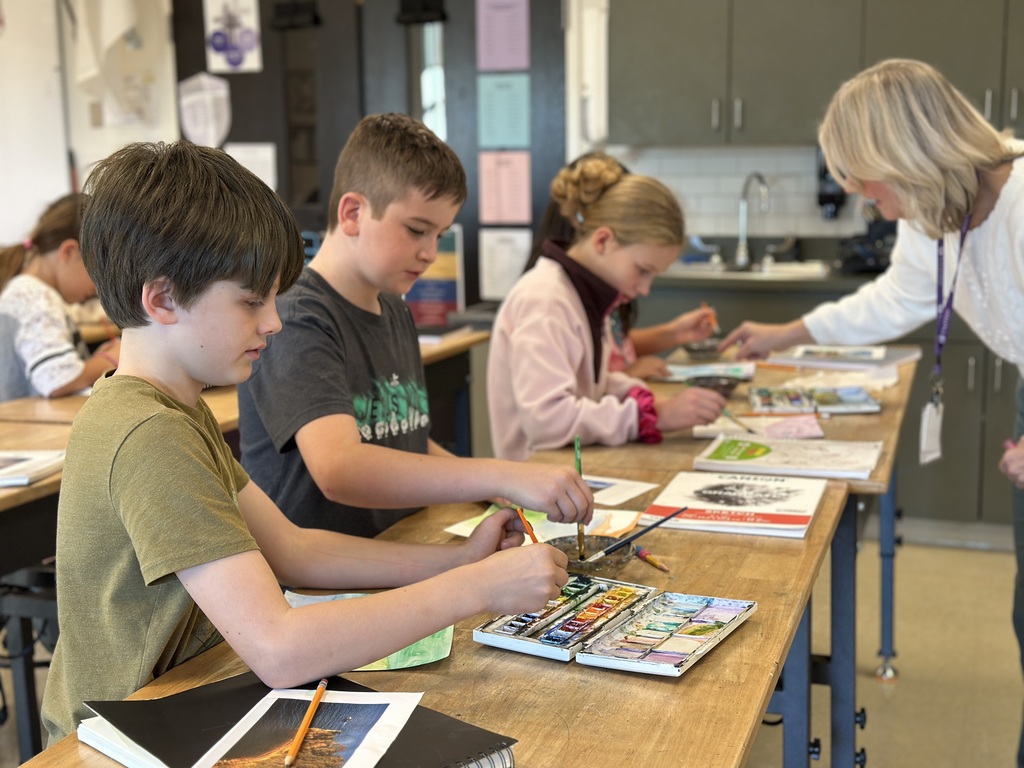 students working on a painting project