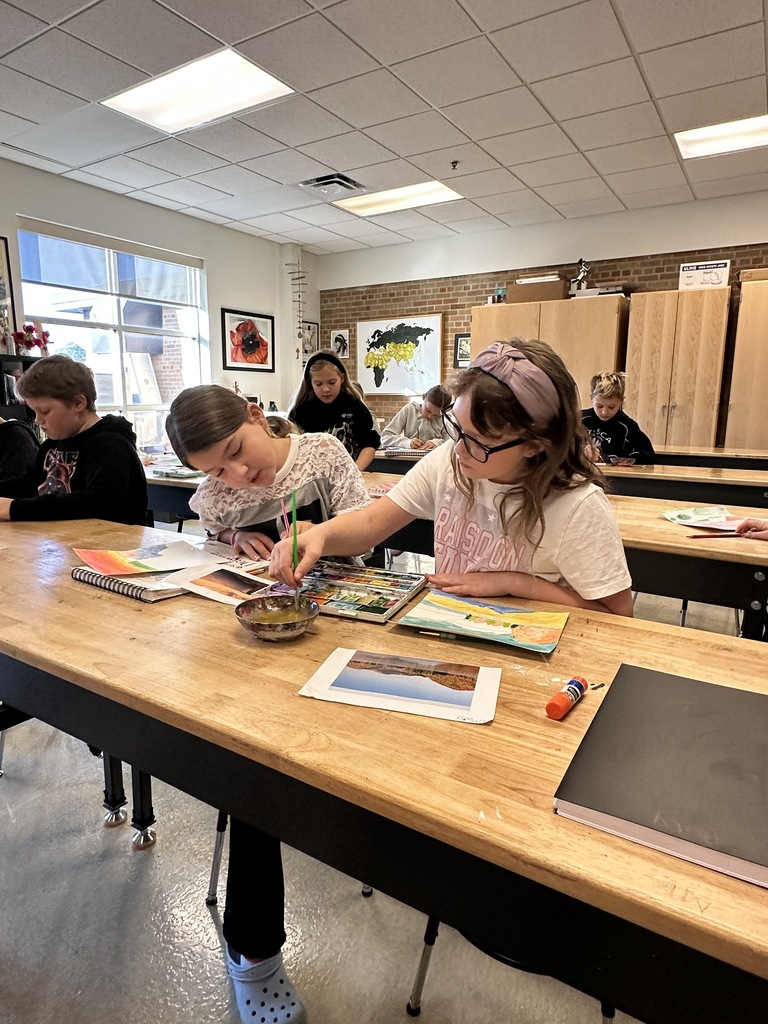 students working on a painting project