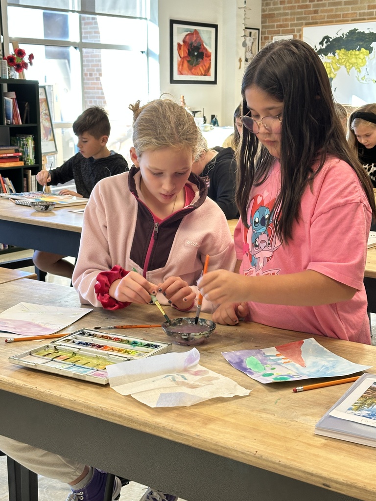 two students painting