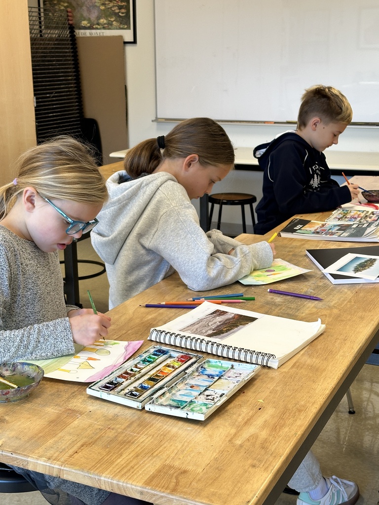 students working on a painting project