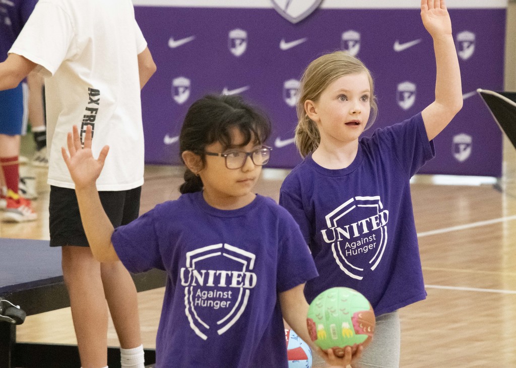younger students playing volleyball