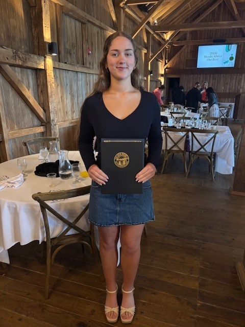 Aurianna Cusick for being recognized at the Heads Above the Rest Breakfast.