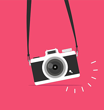 Image of black and white camera handing from black strap on hotpink background.