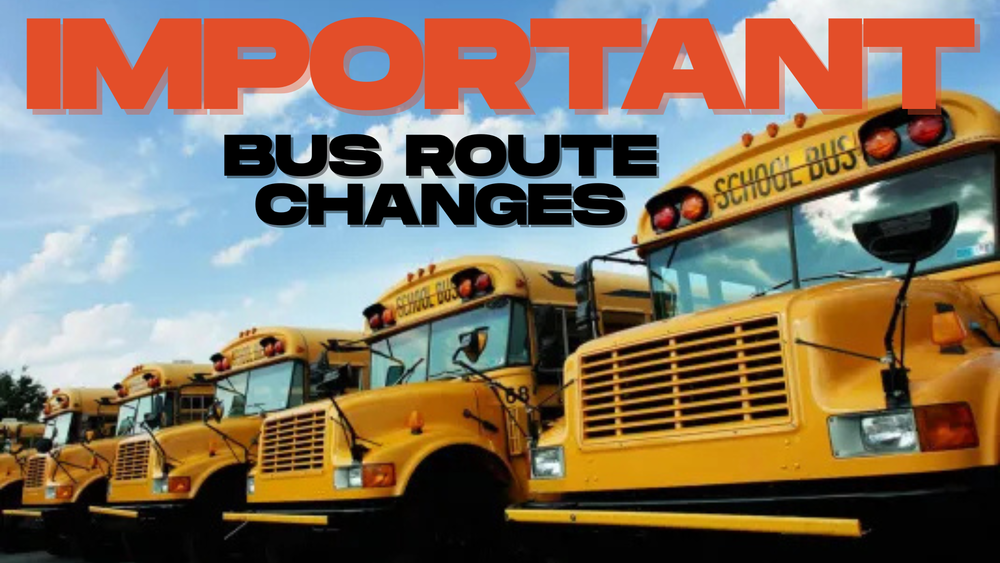 Image with row of school buses and a blue sky with cloud cover.