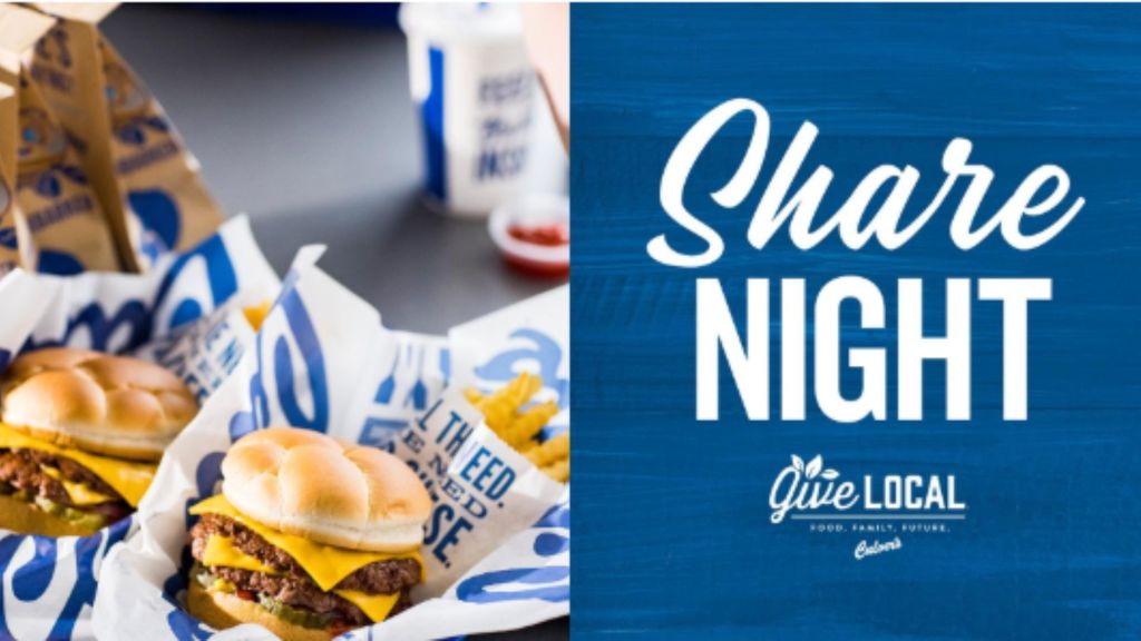 Image of two Culver's burger baskets with fries, plus a drink, ketchup and two to go bags in the background.